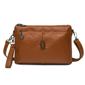 Women's Faux Leather Multi Pocket Crossbody Bag in Brown by Juana Fashion